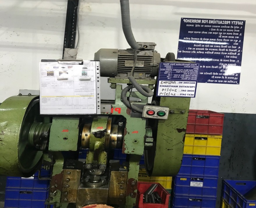 Power press machine for automotive sheet metal stamping at manufacturing plant.
